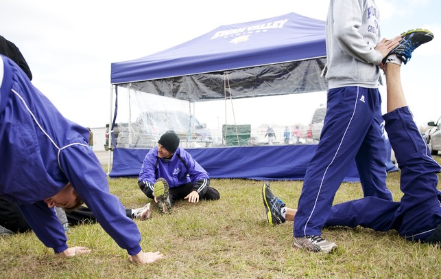 The Ann Arbor Pioneer HIgh School cross country team stretches before their race on Saturday. They finished fifth in the MHSAA Division One race. Daniel Brenner I AnnArbor.com